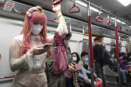 Covid-19 - Masked passengers in the Hong Kong MTR