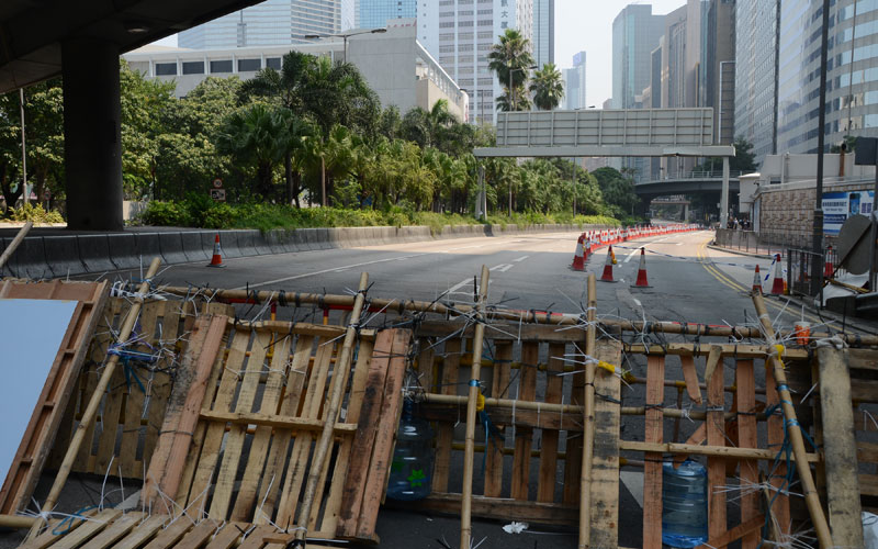 Makeshift barricades face a deserted Gloucester Road / photo: Vijay Verghese
