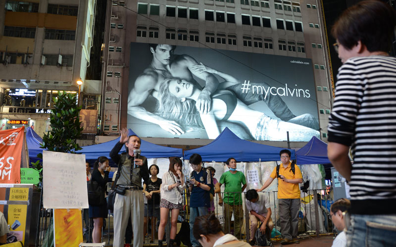 Watched by Calvin Klein, teachers and protesters speak out at street gatherings / photo: Vijay Verghese