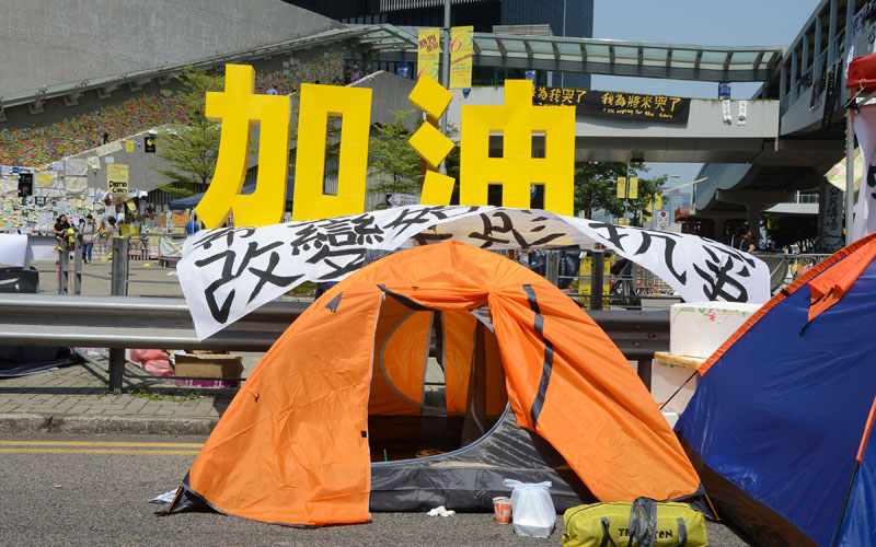 Orange tent in need of hope - the yellow sign reads, 'Cheer up' / photo: Vijay Verghese