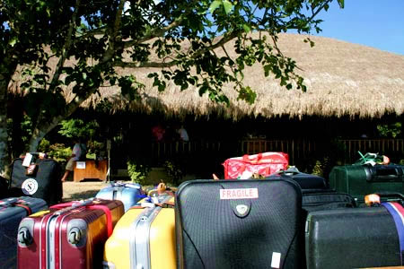 How tough is your stuff, unloaded bags and suitcases at El Nido's dusty island landing strip