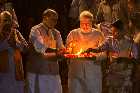 BJP leader Narendra Modi, (centre), performs Hindu rituals on the banks of the river Ganges